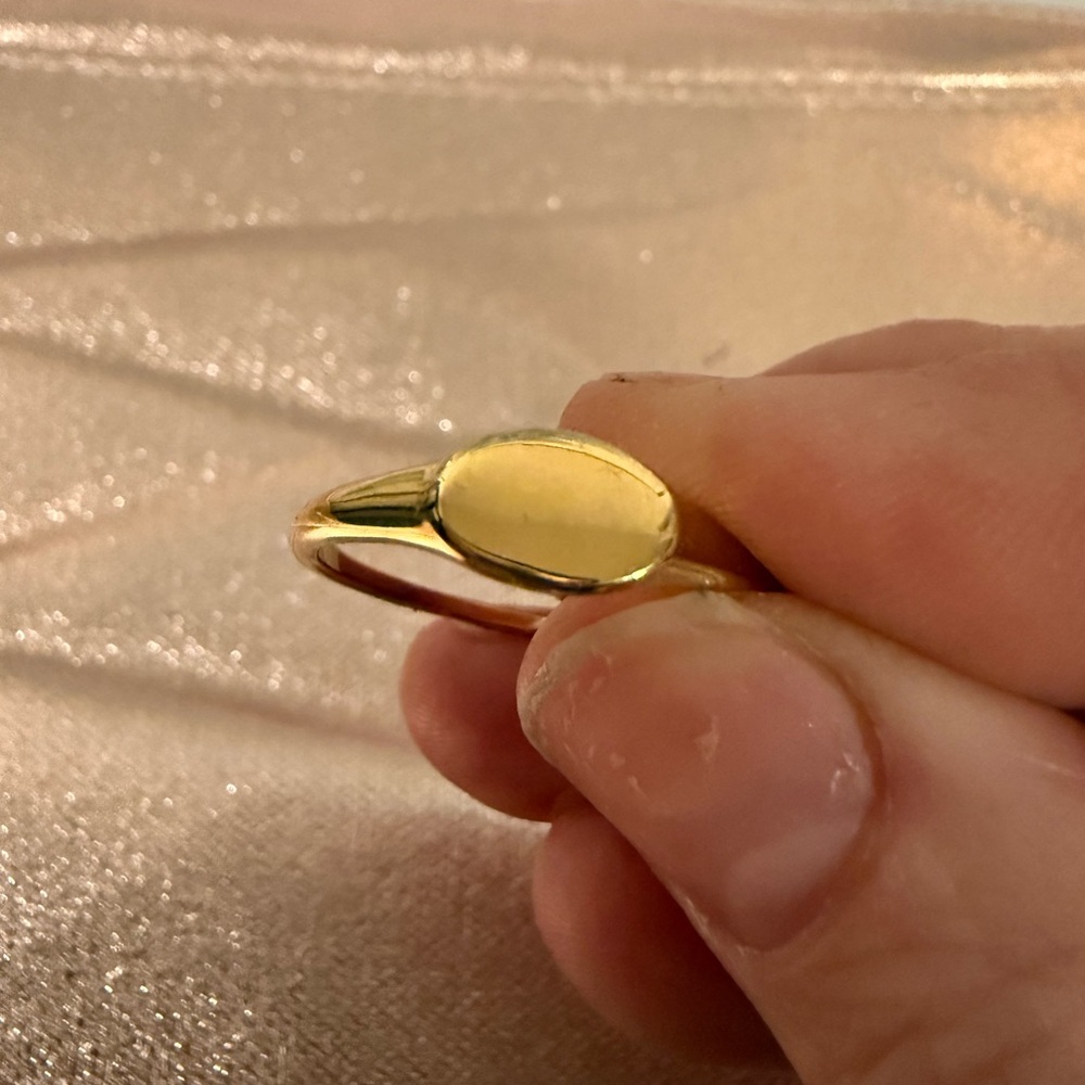 14k Gold Plated size 10 stacking ring. Comes with jewelry pouch.